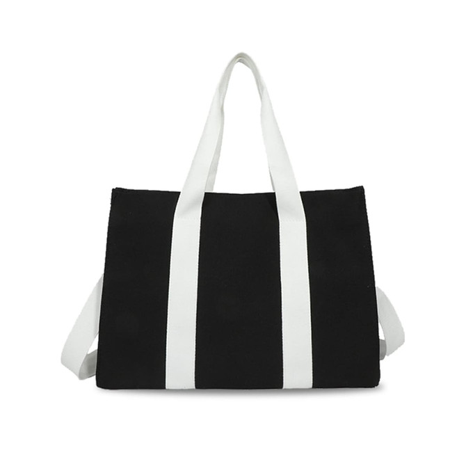 A black canvas grocery shopping bag with white handles and a logo on the front.