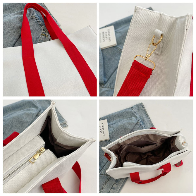 A canvas grocery shopping bag in white with red handles, featuring a zippered compartment and interior lining.