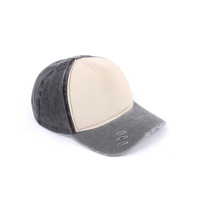 A distressed cotton baseball cap featuring a two-tone design in grey and beige, with a worn look and logo.