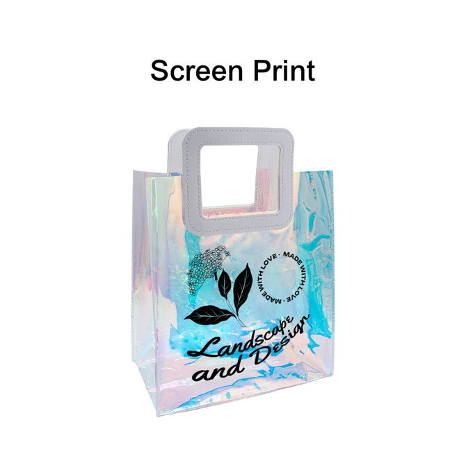 An iridescent rainbow PVC bag with a square handle and a printed design featuring floral elements and text. An iridescent rainbow PVC bag with a square handle and a printed design featuring floral elements and text.