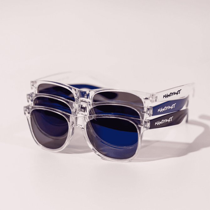 A pair of clear and blue sunglasses stacked on top of each other, featuring a logo on the side.