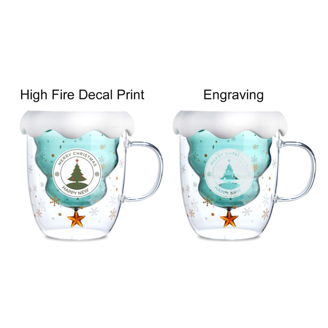 A double wall mug featuring a Christmas tree design, teal colour with a white frosted rim and a handle.