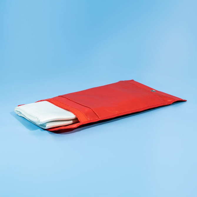A red pouch containing a white fiberglass emergency fire blanket. Features a snap closure.
