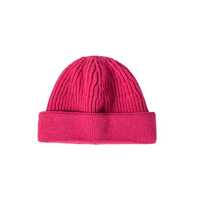 A round beanie in bright pink, featuring ribbed texture and a folded cuff at the bottom.