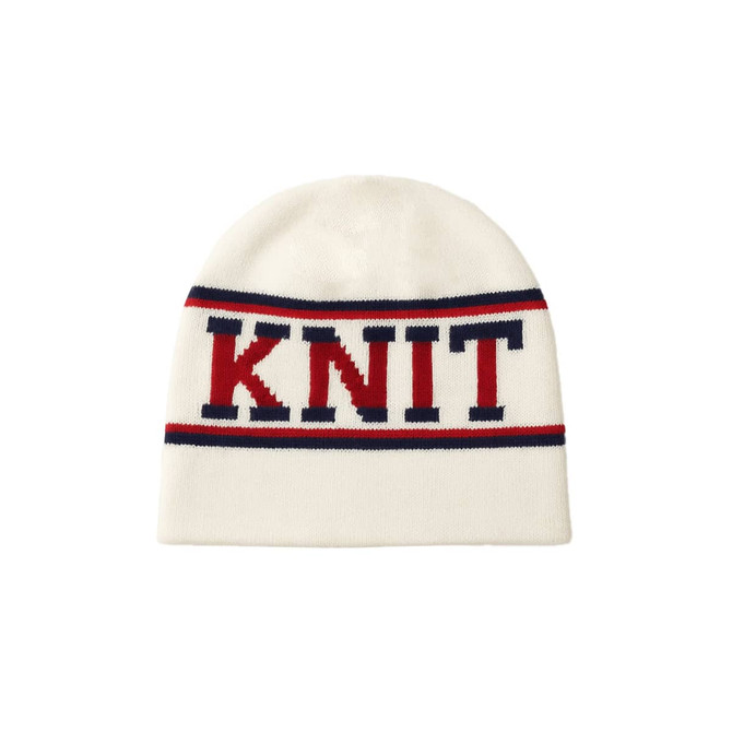 A white Jacquard beanie featuring red and navy blue stripes with a knit design. It has a logo.