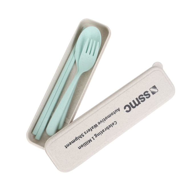 A portable utensils set in light green, including a spoon and fork, housed in a beige case with a logo.