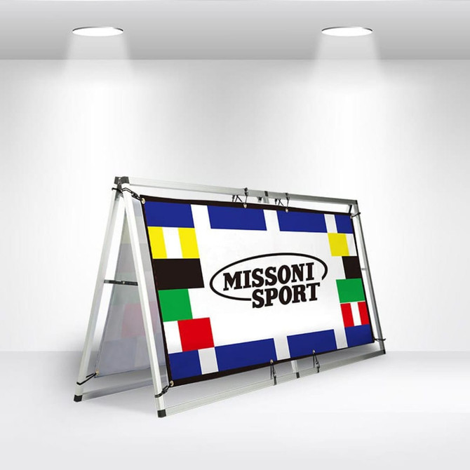 A-frame banner stand featuring a colourful design with a branded logo, set in a well-lit exhibition space.