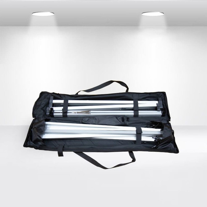 A black carrying case containing disassembled metal poles for an A-frame banner stand.