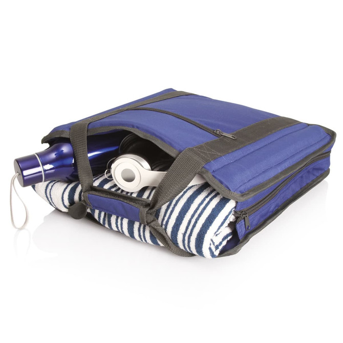 A blue carry bag contains a drink bottle, headphones, and a striped towel, secured with a zipper.