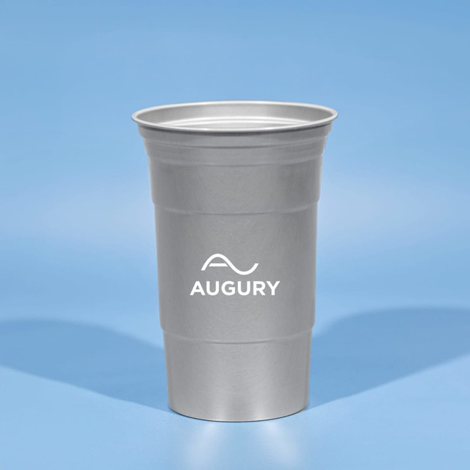 A drink bottle featuring a silver, recycled aluminum cup with a logo on the front against a light blue background.
