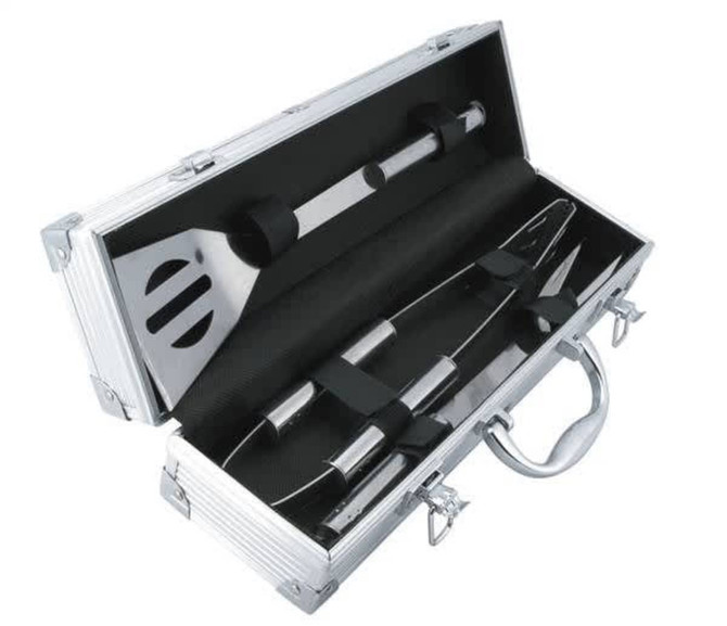 A BBQ set in a silver case, featuring a spatula, tongs, and a fork, with black accents.