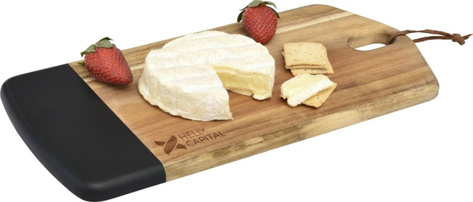 A wooden cheese board with a black edge, featuring brie cheese, crackers, and strawberries. It has a logo.