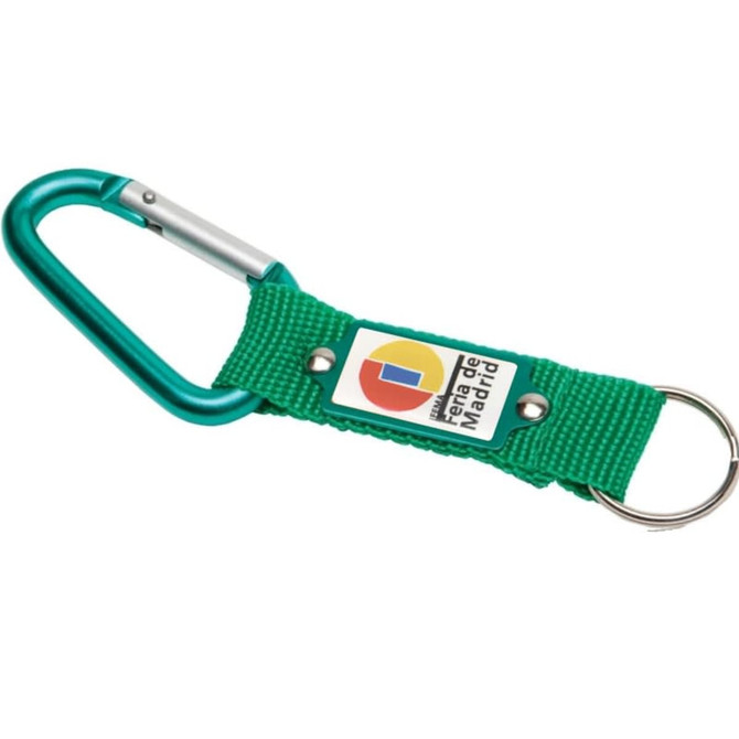 A green keyring with a carabiner and a fabric strap, featuring a logo on the strap.