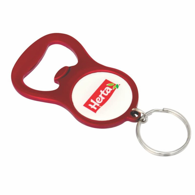A drink bottle opener keyring in red with a circular area for branding. Features a metal keyring attachment.