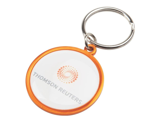 A round keyring with an orange border and a clear central section, featuring a logo.