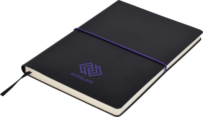 A black A5 notepad with a purple elastic band and logo on the cover, featuring plain pages.