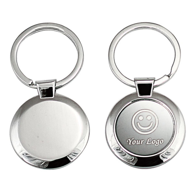 A keyring featuring a circular metal design with a shiny silver finish and a space for custom branding.