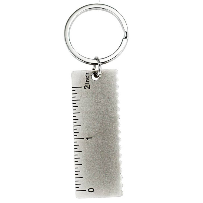A keychain featuring a silver-coloured ruler design with inch markings.