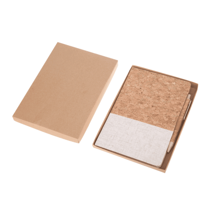 A cork notebook with a textured white cover, presented in a kraft cardboard box, includes a pen.