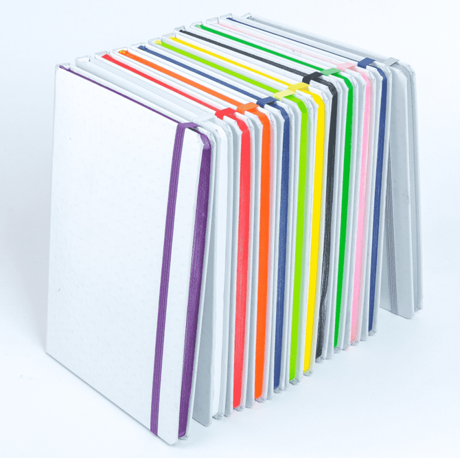 A stack of colourful notebooks featuring a variety of bright covers and matching elastic bands.