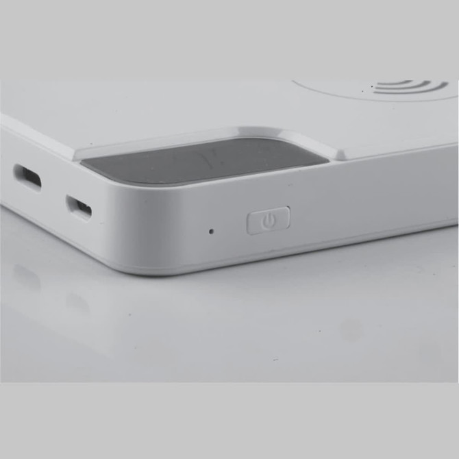 A white power bank featuring charging ports, a power button, and a sleek design with rounded edges.