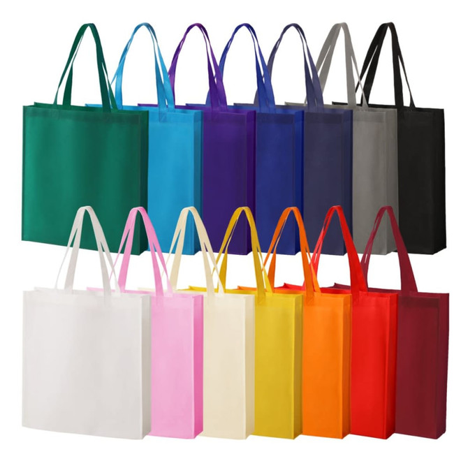 A collection of reusable tote bags in various colours, including green, blue, purple, black, and pink, with handles.