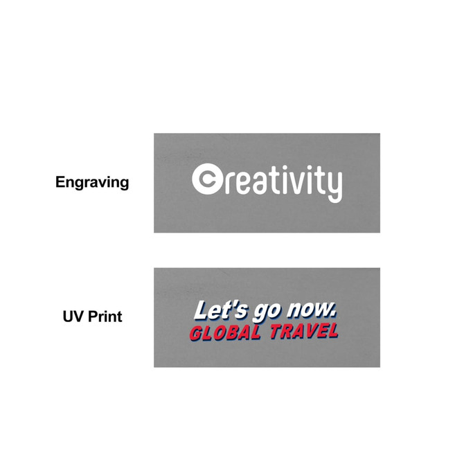 A grey promotional product with two printed labels, one featuring the word "creativity" and the other "Let's go now. GLOBAL TRAVEL."
