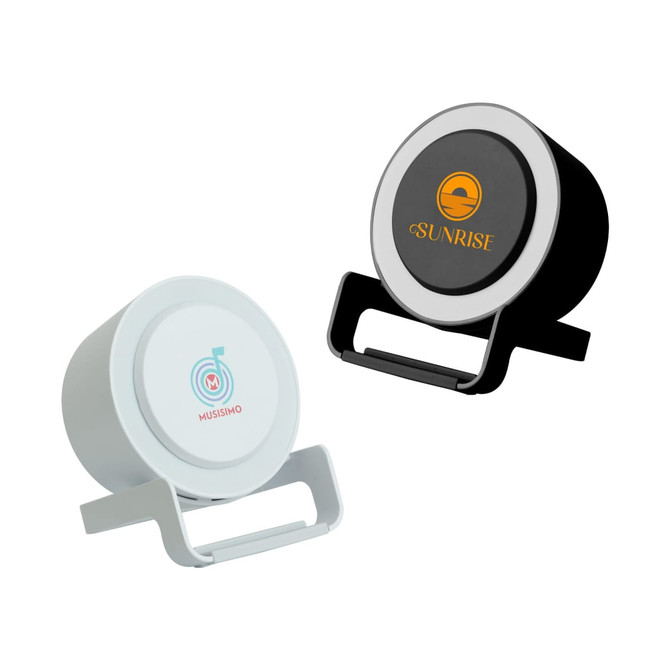 A night light speaker with a wireless charger, featuring black and white finishes, along with branding on the front.