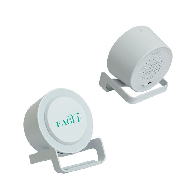 A white night light speaker with a wireless charger, featuring a simple design and minimal branding.