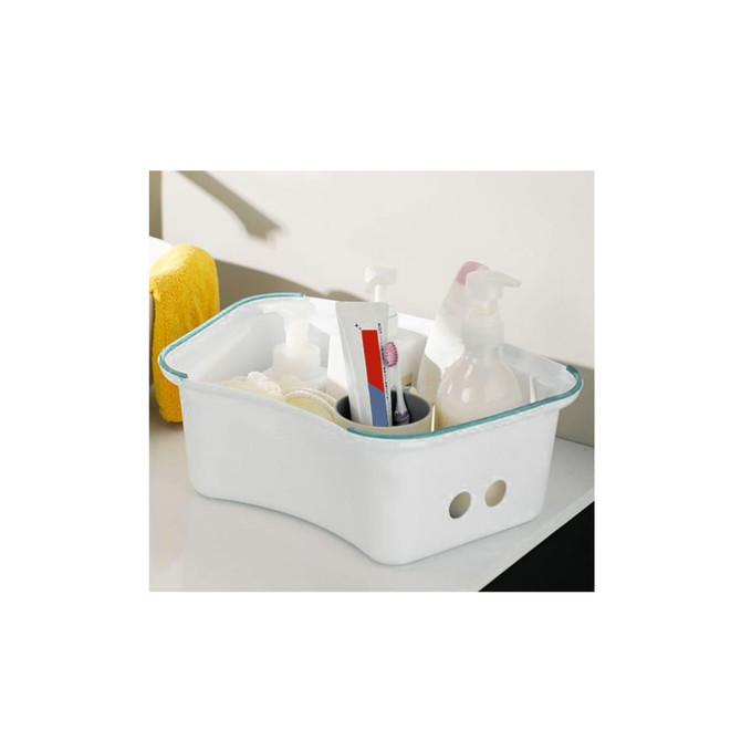 A white storage caddy with various toiletries and a towel, featuring rounded edges and multiple compartments.