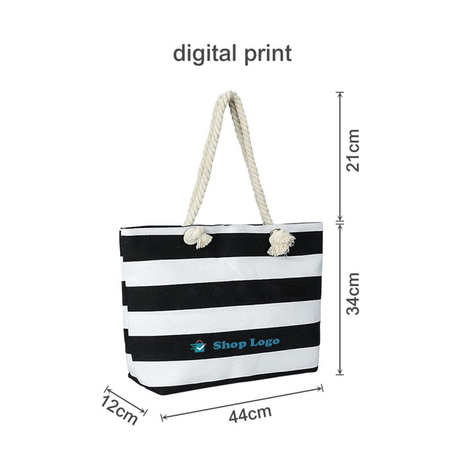 A striped tote bag in black and white with a rope handle and a logo. Dimensions: 44cm wide, 34cm high.