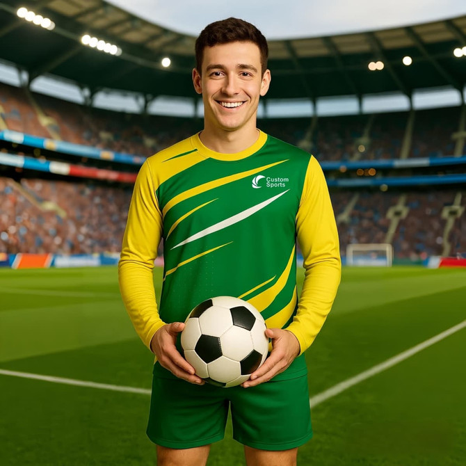 A long-sleeved sports shirt in green and yellow, featuring a logo, paired with a soccer ball.