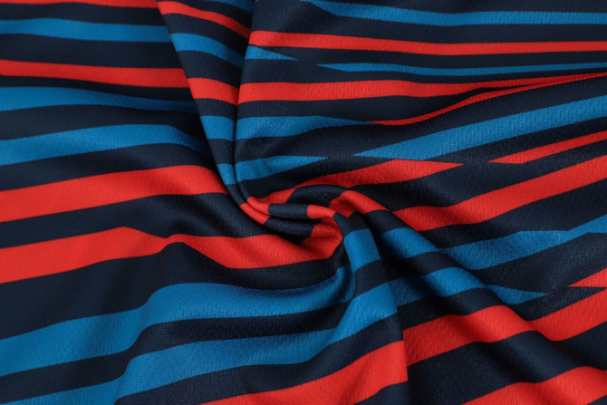 A fabric featuring horizontal stripes in red, blue, and navy, ideal for a sublimated sport long sleeves polo.
