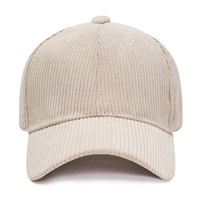 A corduroy baseball cap in a light beige colour with a curved brim and a textured design. It has a logo.