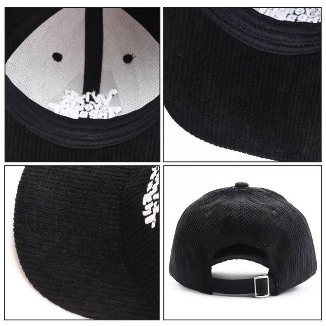 A black corduroy baseball cap featuring a flat brim and adjustable strap at the back, with an interior lining.