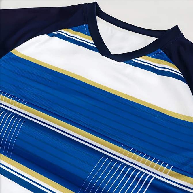 A blue and white V-neck raglan tee shirt with asymmetric stripes and a logo on the sleeve.