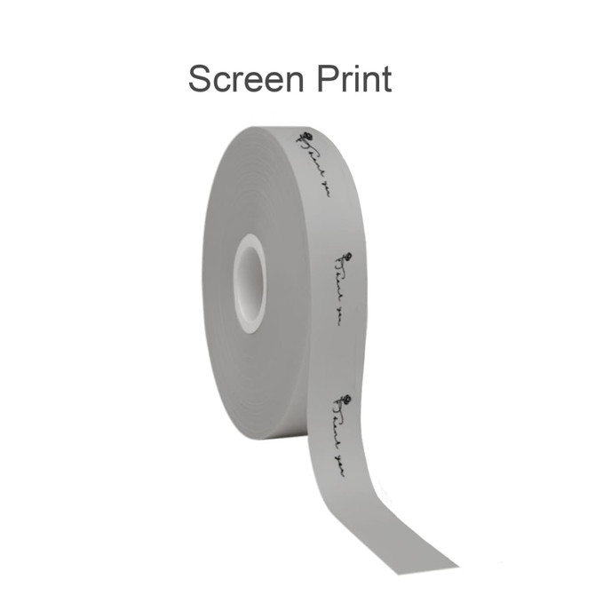 A roll of grey screen printed cotton ribbon, featuring a repeating patterned design and a central core.