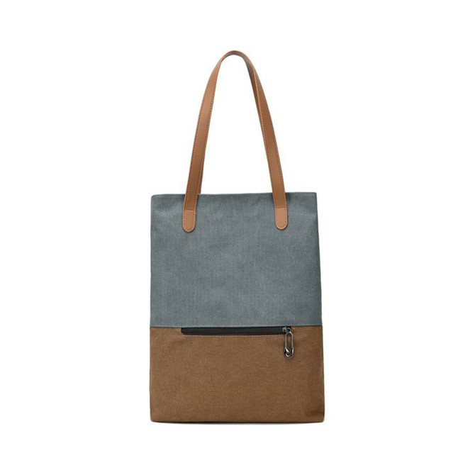 A convertible canvas backpack to tote bag in grey and brown, featuring two leather straps and a zippered pocket.