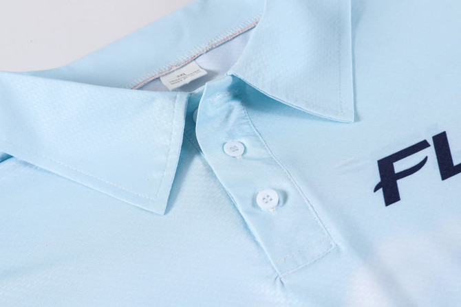 A light blue polyester spandex polo shirt featuring a collar and buttoned placket, with a logo on the front.