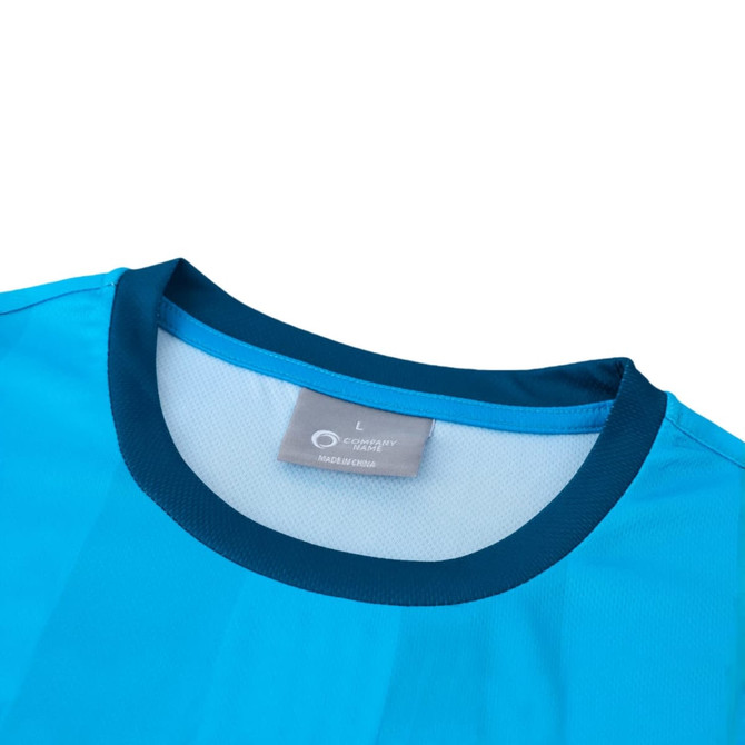 A light blue 100% polyester sublimated tee shirt featuring a navy collar and a tag indicating size L.