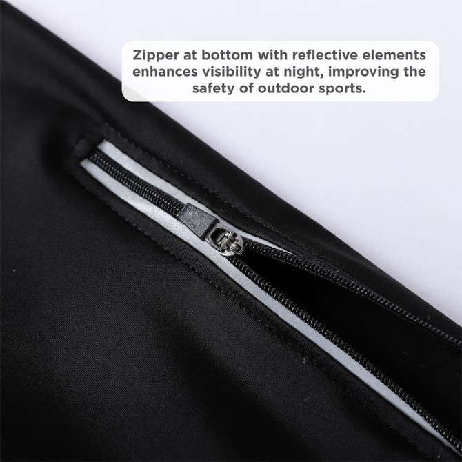 A close-up of black cycling tights featuring a zipper at the bottom and reflective elements for visibility.