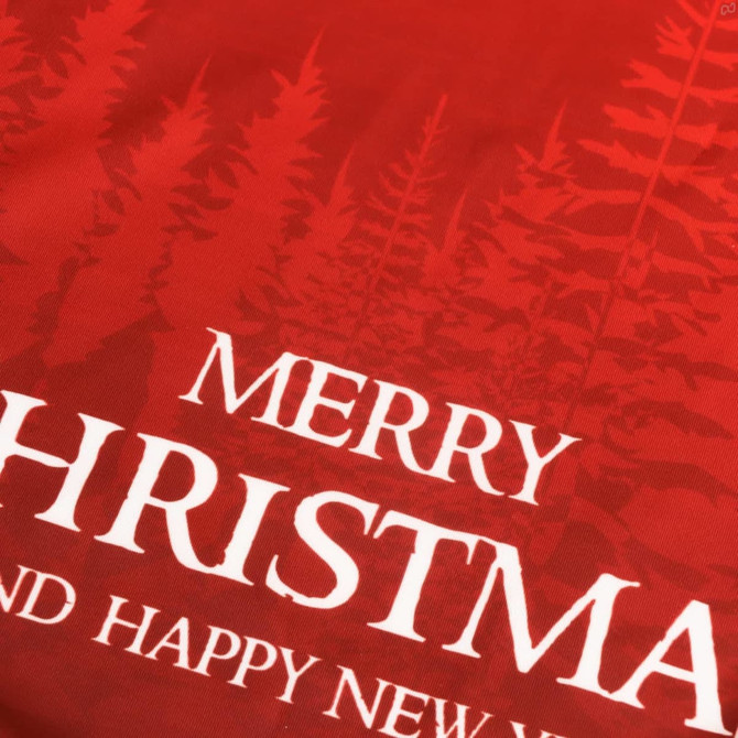 A red sweatshirt featuring a forest design and white text stating "Merry Christmas and Happy New Year."