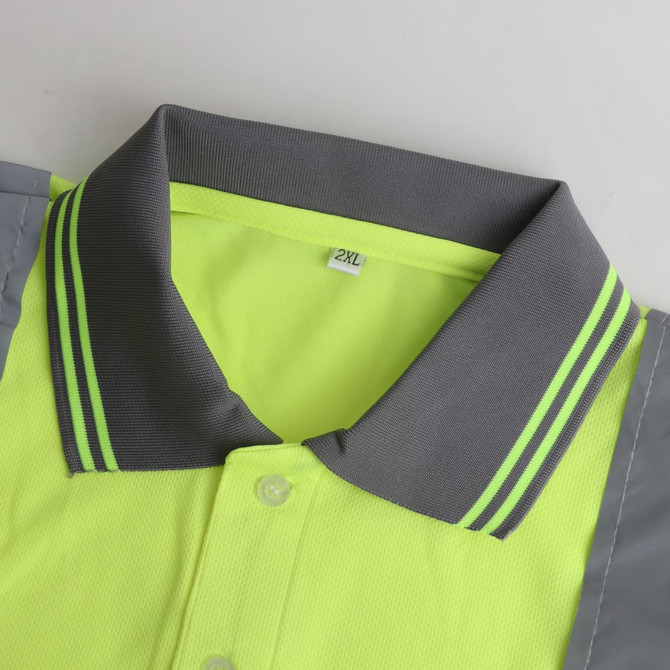 A bright yellow and grey unisex polyester hi-vis reflective short-sleeve polo with a collar and a logo.