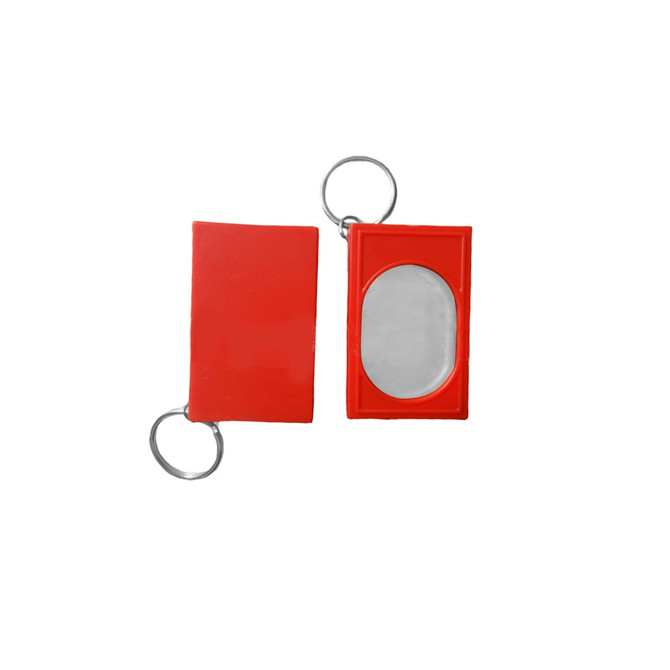 A red training clicker with a keyring attachment, featuring a shiny metal click surface.