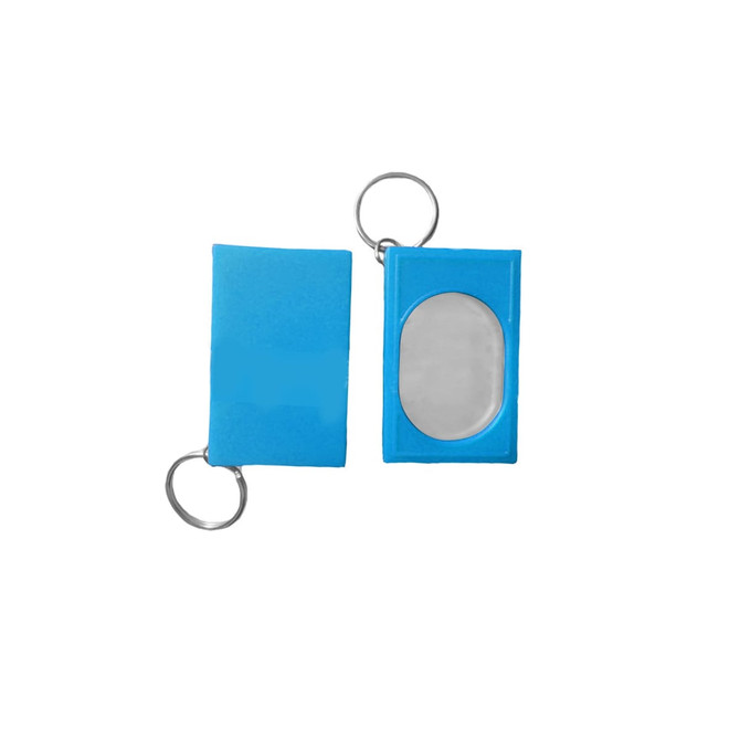A blue pet training clicker with a metal key ring, featuring a rectangular shape and a clear, oval button.