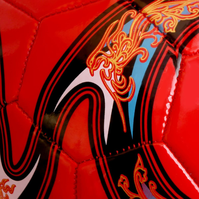 A red promotional soccer ball featuring intricate black and gold designs and a logo.