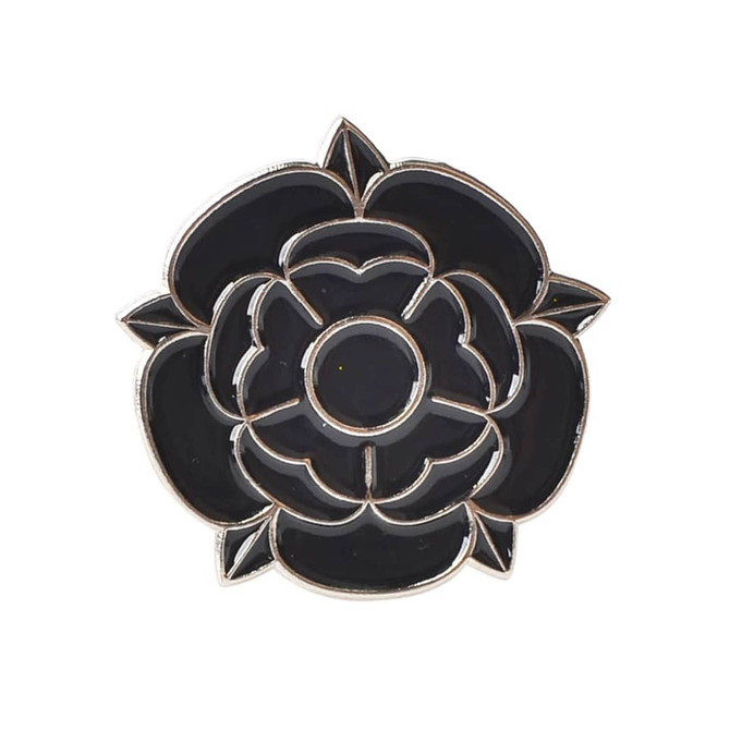 A black rose-shaped lapel pin with a silver outline and detailing, featuring an embedded logo.
