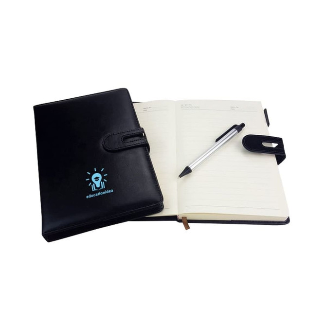 A black PU notebook with a pen, featuring a clasp and an interior with lined pages. It has a logo on the cover.