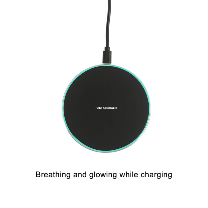 A round, black wireless charger with a glowing edge, connected to a power source. It features a logo.