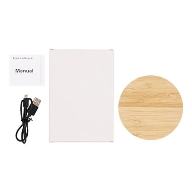A bamboo wireless charger in a circular shape, accompanied by a manual and a USB cable.